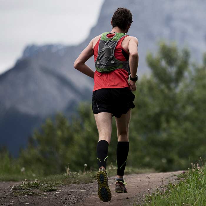 Man running in compression socks